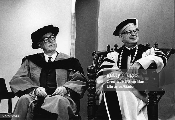 Lincoln Gordon, Candid photograph, Gordon and unidentified man in academic robes at 25th anniversary of SAIS, c 58 years of age, 1968.