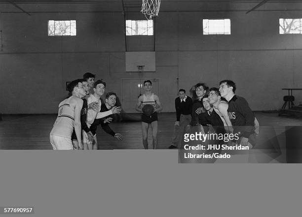 Basketball, Athletic Facilities Player at free-throw line with others waiting for rebound, 1936.