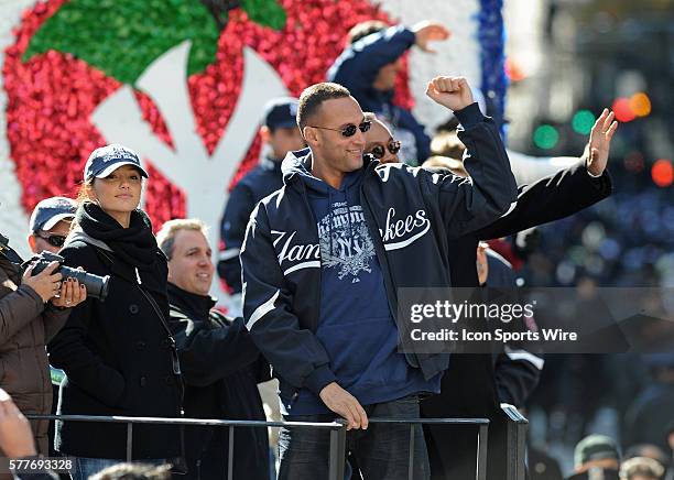 World Series Champion New York Yankees. Derek Jeter rides with his family and girlfriend Minka Kelly on a championship float down The Canyon Of Heros...