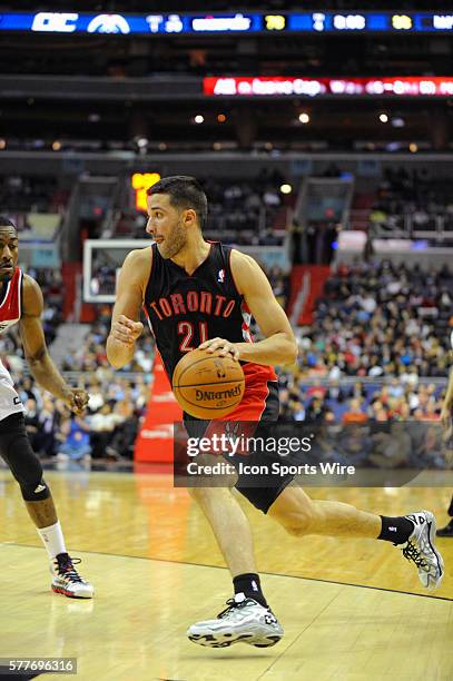 Toronto Raptors point guard Greivis Vasquez in action against Washington Wizards point guard John Wall at the Verizon Center in Washington, D.C....