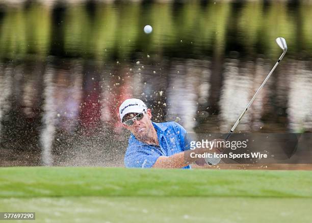 Brian Davis punches the ball out of the bunker during the second round of the Wyndham Championship at Sedgefield Country Club in Greensboro, NC.