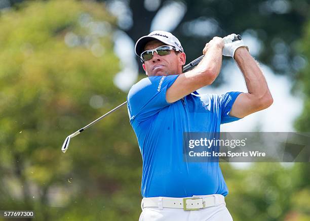 Brian Davis hits an iron shot off of the 16th par 3 tee box during the second round of the Wyndham Championship at Sedgefield Country Club in...