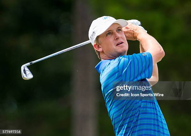 David Toms hits an iron shot off of the 16th par 3 tee box during the second round of the Wyndham Championship at Sedgefield Country Club in...