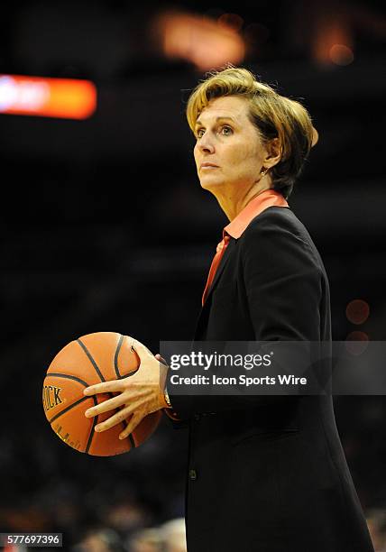 University of Texas Longhorns head basketball coach Gail Goestenkors holds a basketball during a break in the game against the University of...