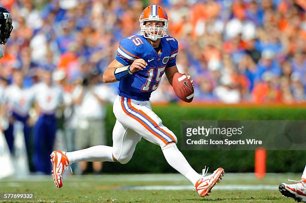 Florida quarterback Tim Tebow rolls out of the pocket in the first half as the University of Florida Gators defeated the FIU Golden Panthers, 62-3,...