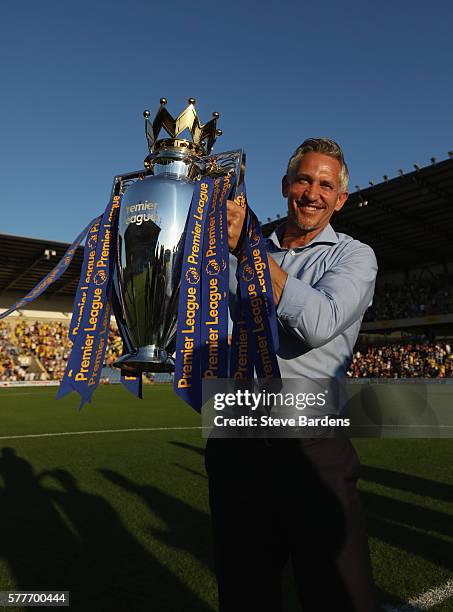 Gary Lineker poses for a picture with the Premier League Trophy prior to the pre-season friendly between Oxford City and Leicester City at Kassam...
