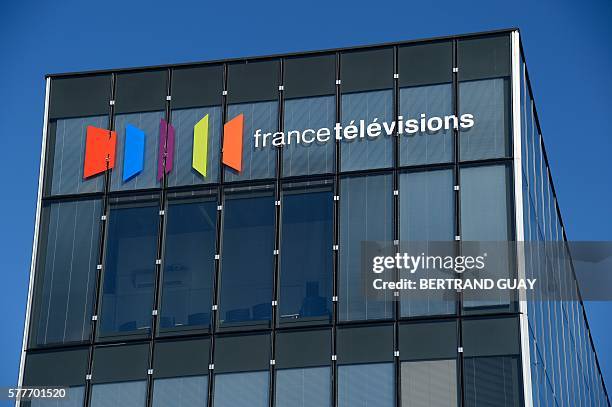 Picture taken on July 19, 2016 in Paris, shows the facade of French public national television broadcaster "France Television" and its logo. / AFP /...