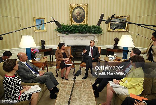 President Barack Obama speaks to the media as White House Domestic Policy Council Cecilia Munoz, Homeland Security Secretary Jeh Johnson, Attorney...
