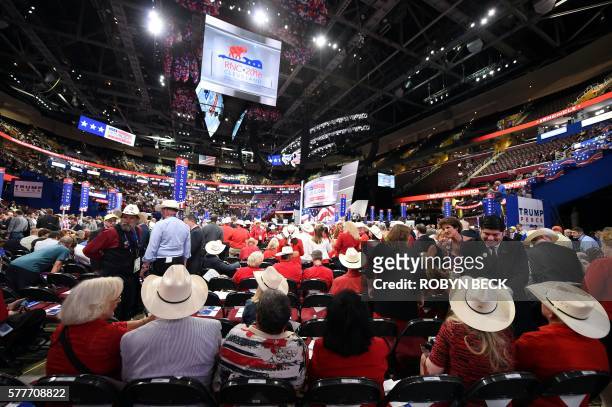 Delegates crowd the floor during the roll call of states on the second day of the Republican National Convention on July 19, 2016 at Quicken Loans...