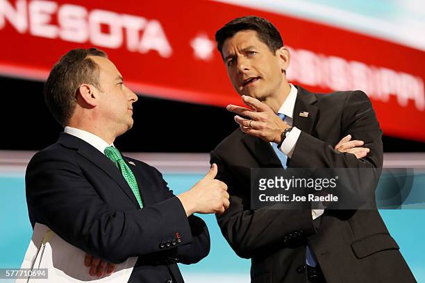 Reince Priebus, chairman of the Republican National Committee, and Speaker of the House Paul Ryan talk on stage after roll call on the second day of...