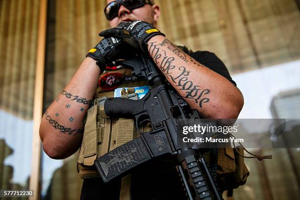 Trevor Leis from Lima, Ohio, of the West Ohio Minutemen group stand guard outside the 2016 Republican National Convention in Cleveland, Ohio, on July...