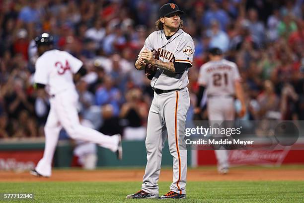 Jake Peavy of the San Francisco Giants reacts after David Ortiz of the Boston Red Sox hit a three run homer during the fourth inning at Fenway Park...