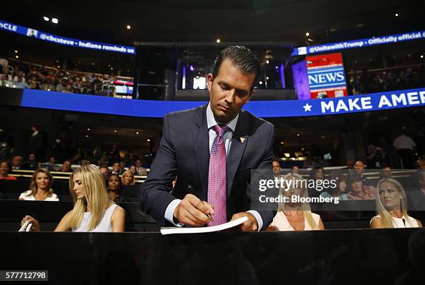 Donald Trump Jr., son of Presumptive Republican Presidential Nominee Donald Trump, center, makes a note as Ivanka Trump, daughter of Presumptive...