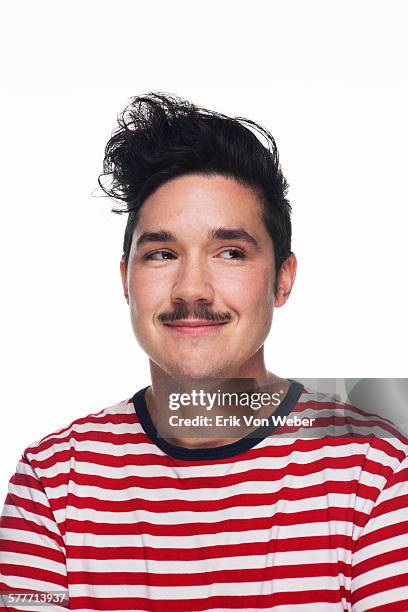 portrait of transgender man with white background - red shirt stock-fotos und bilder