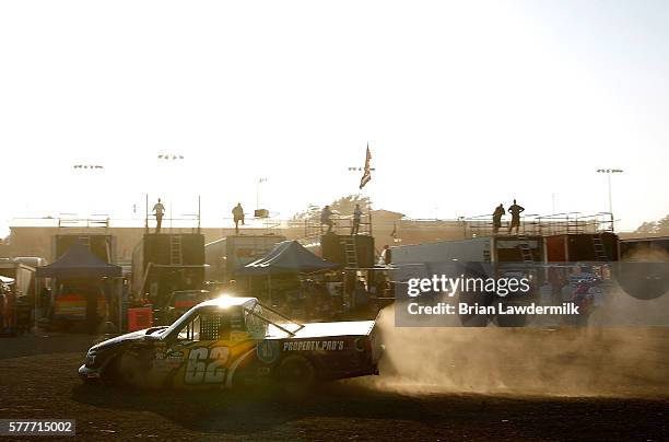 Donnie Levister, driver of the Property Pro's Toyota, drives into the garage after wrecking during practice for the 4th Annual Aspen Dental Eldora...