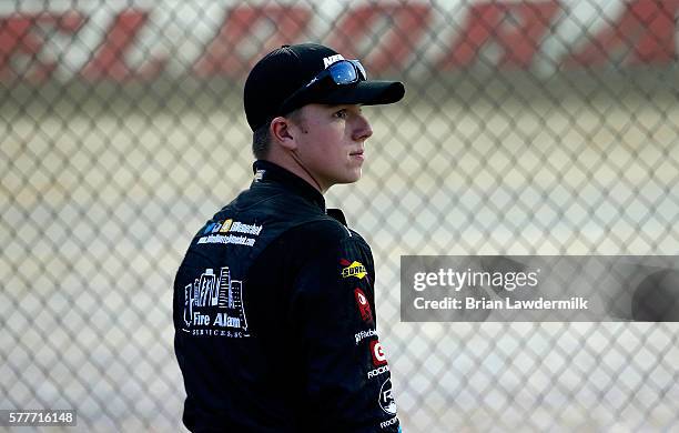 John H. Nemechek, driver of the Berry's Bullets Chevrolet, stands on pit road during practice for the 4th Annual Aspen Dental Eldora Dirt Derby at...