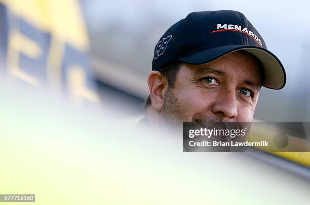 Matt Crafton, driver of the Chi-Chi's/Menards Toyota, stands in the garage during practice for the 4th Annual Aspen Dental Eldora Dirt Derby at...