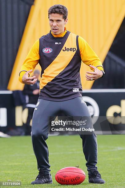 Hernanes of Juventus, dressed in a Tigers guernsey, gestures over an AFL football during a Richmond Tigers AFL and Juventus FC media opportunity at...