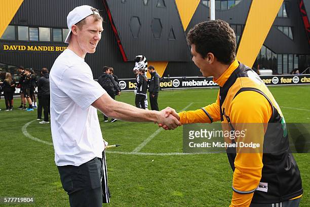 Jack Riewolt of the Tigers comes in on his day off to meet Hernanes of Juventus during a Richmond Tigers AFL and Juventus FC media opportunity at...