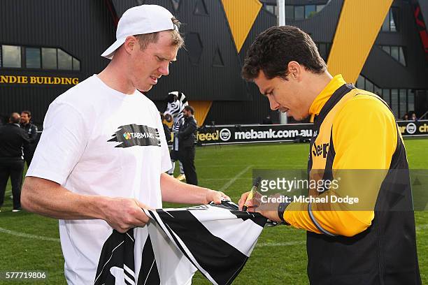 Jack Riewolt of the Tigers comes in on his day off to meet Hernanes of Juventus during a Richmond Tigers AFL and Juventus FC media opportunity at...