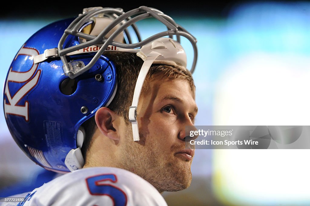 Todd Reesing Dimensional University of Kansas Jayhawks QB Todd Reesing watches a replay during ...