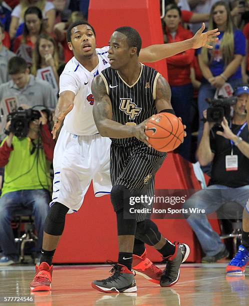 March 2014 - UCF Knights guard Isaiah Sykes is defended by SMU Mustangs guard Sterling Brown during the American Athletic Conference college...