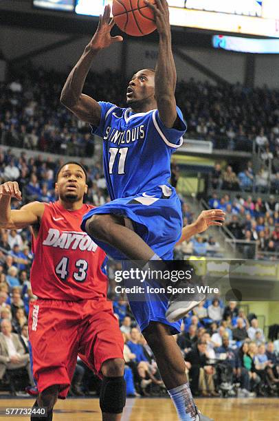 Saint Louis University guard Mike McCall Jr. Goes in for a jump shot over Dayton Flyers guard Vee Sanford during an Atlantic 10 Conference basketball...