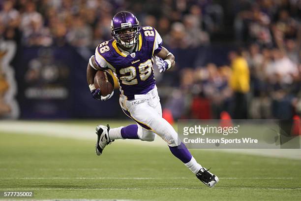 Minnesota Vikings running back Adrian Peterson runs with the ball. The Minnesota Vikings defeated the Cincinnati Bengals by a score of 30 to 10 at...