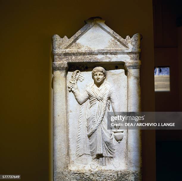 Stele of a girl with sistrum, 150 AD, discovered in 2003 in the Odeon of Herodes Atticus during construction of the Athens metro, Greece. Greek-Roman...