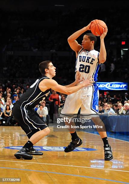 Duke guard Andre Dawkins looks to pass while guarded by Gonzaga guard Mike Hart during a game between the Gonzaga Bulldogs and the Duke Blue Devils...