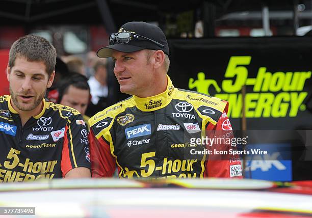 Clint Bowyer Michael Waltrip Racing 5-Hour Energy Toyota Camry talks to a crew member before practice for the Irwin Tools Night Race at Bristol Motor...