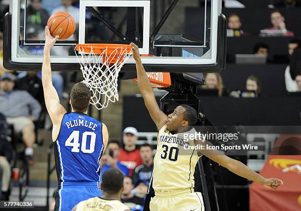 Wake Forest Demon Deacons forward Travis McKie cant get the block on the layup put in by Duke Blue Devils center Marshall Plumlee at the Lawrence...