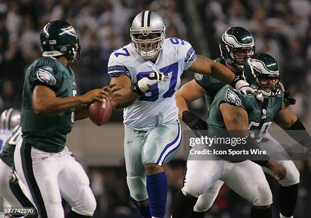 Dallas Cowboys defensive end Jason Hatcher puts the heat on Philadelphia Eagles quarterback Donovan McNabb during the first half of the game between...