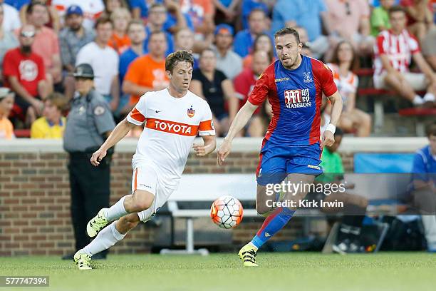 Antoine Hoppenot of FC Cincinnati and Jordon Mutch of Crystal Palace FC chase after the ball during the match at Nippert Stadium on July 16, 2016 in...