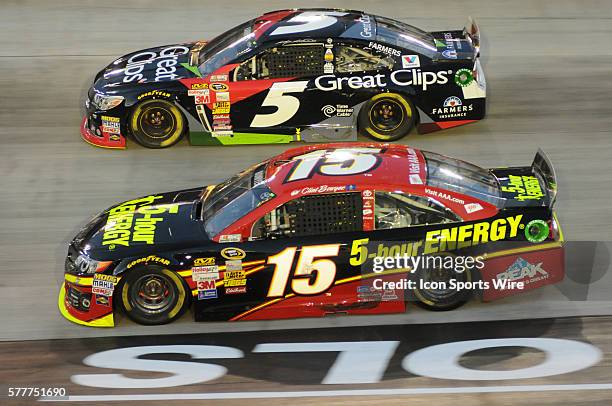 Clint Bowyer Michael Waltrip Racing 5-Hour Energy Toyota Camry and Kasey Kahne Hendrick Motorsports Great Clips Chevrolet SS race side by side during...