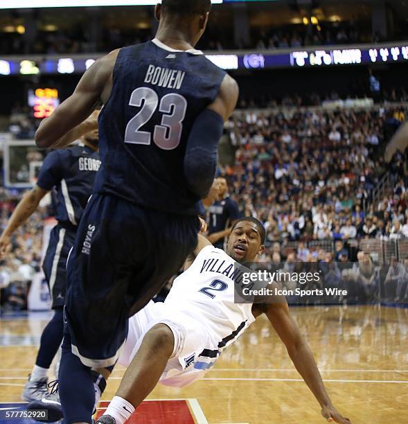 Villanova Wildcats forward Kris Jenkins falls backwards after heavily colliding with Georgetown Hoyas forward Aaron Bowen in an Big East basketball...