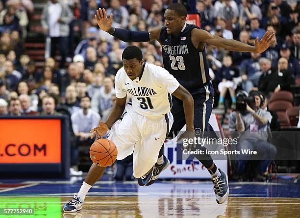 Villanova Wildcats guard Dylan Ennis controls the ball past Georgetown Hoyas forward Aaron Bowen in an Big East basketball game at the Wells Fargo...