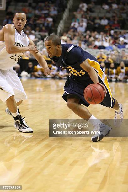 Murray State's guard Jewuan Long drives by Vanderbilt's guard John Jenkins as Murray State beats Vanderbilt 66-65 in the first round of the 2010 NCAA...