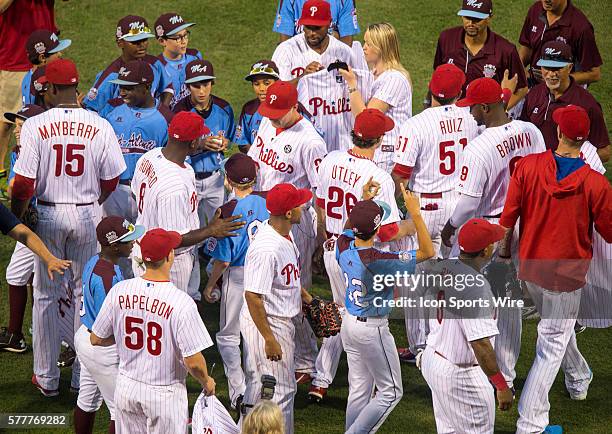 The Philadelphia Phillies pay tribute to the Taney Dragons in the baseball diamond as they give Phillies baseball jerseys to the team before a Major...