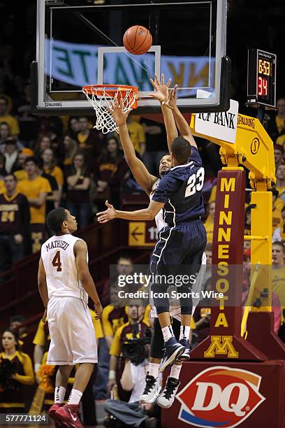 March 9 Nittany Lions guard Tim Frazier with a shot over Minnesota forward Maurice Walker during the second half at the Minnesota Gophers game versus...