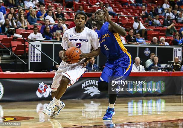 Boise State Broncos guard Derrick Marks drives past San Jose State Spartans forward Jaleel Williams to the basket during the game between San Jose...