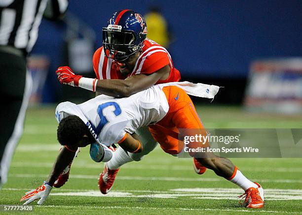 Mississippi Rebels wide receiver Laquon Treadwell fights with Boise State Broncos cornerback Donte Deayon in first half action of the Ole Miss Rebels...