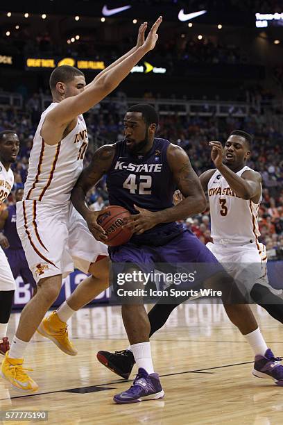 Kansas State Wildcats forward Thomas Gipson battles for position during the quarterfinals of the Phillips 66 Big 12 Men's Basketball Championship....