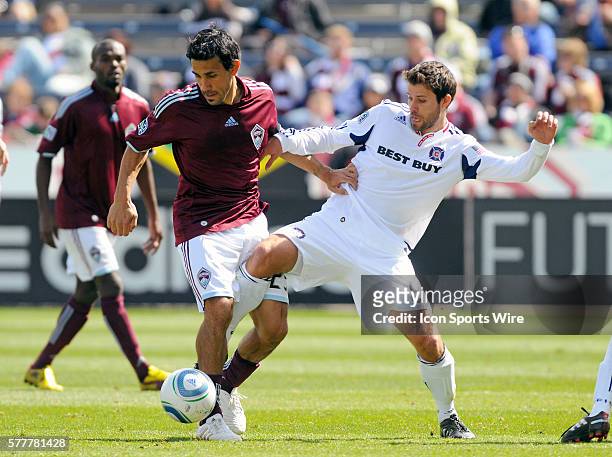 Colorado Rapids midfielder Pablo Mastroeni and Chicago Fire midfielder Peter Lowry during a Major League Soccer game between the Colorado Rapids and...