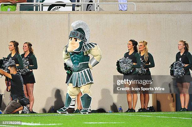 Sparty and the Michigan State Spartans dance team during the game on Friday evening, Spartan Stadium, East Lansing, Michigan.