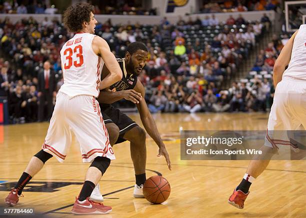 Amedeo Della Valle of the Ohio State Buckeyes guarding Rapheal Davis of the Purdue Boilermakers during the game between the Purdue Boilermakers and...