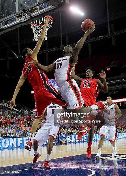 Georgia Bulldogs forward Brandon Morris drives to the basket against Mississippi Rebels forward Anthony Perez in the Georgia Bulldogs 75-73 victory...