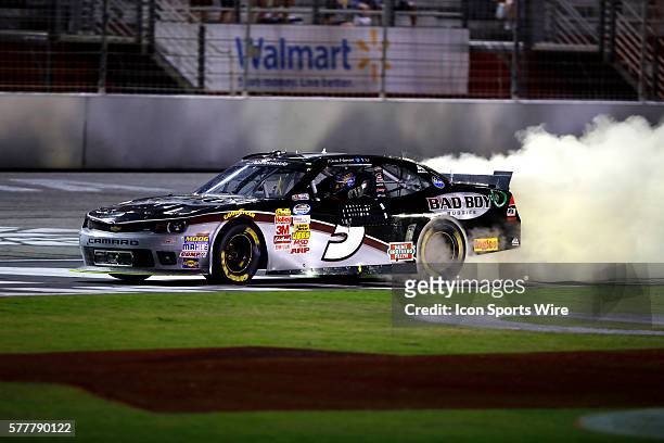 Kevin Harvick celebrates winning the Great Clips 300 with a burnout at the Atlanta Motor Speedway in Hampton, GA.