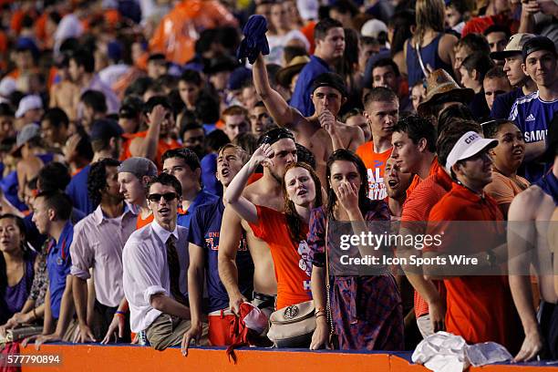 Fans react after hearing that the game was terminated after 1 play during the NCAA Football game between the Idaho Vandals and the Florida Gators at...