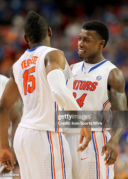 Florida Gators forward Will Yeguete and forward Casey Prather celebrate the victory in the Florida Gators 56-49 victory over the Tennessee Volunteers...